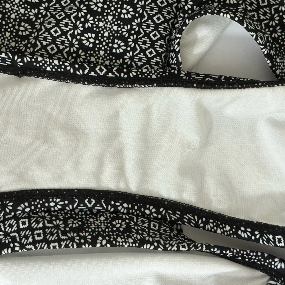 Kona Sol sz med swimsuit in a mini black/white print red print accent on front